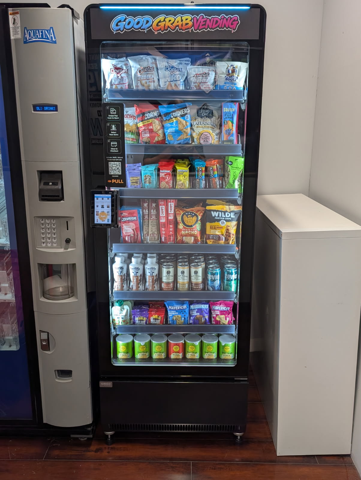 Good Grab Vending machine stocked with snacks and drinks, photographed from the front